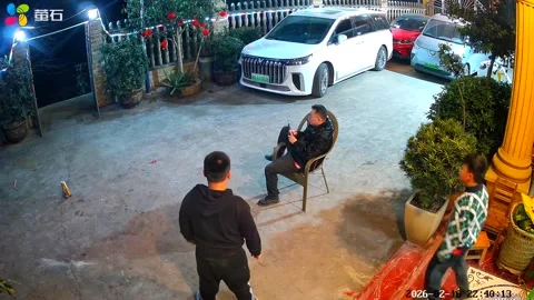 China: Firecracker prank startles man and explodes under parked vehicle i... Stock-Footage 330989875