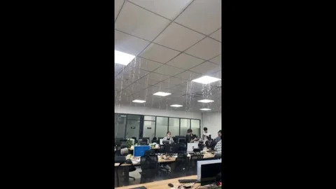 China: Heavy ceiling leak floods office workspace in Guangdong, China Stock Footage 330535826