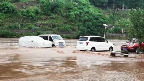 China: Heavy rains trigger floods, local government activates emergency r... Stock Footage 335599922