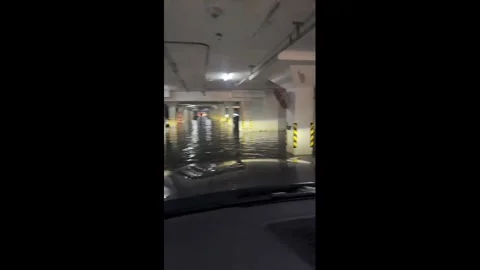 China: Heavy rainstorms leave underground parking garage flooded in Hebei... Stock Footage 343670977