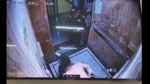 China: Heroic Security Guard Stops Violent Attack in Haikou Elevator Inci... Stock Footage 290093465