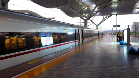 China high speed bullet train at the platform Guangzhou South Railway Station Stock Footage 119921713