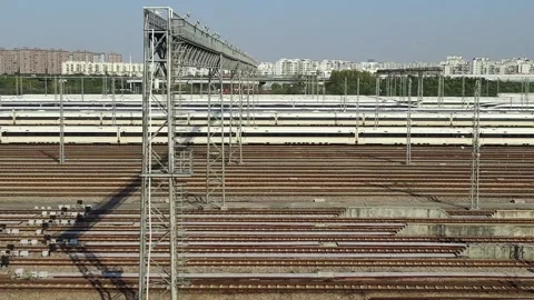 A China High-speed train runing past trains outside a railway station Stock Footage 293663199