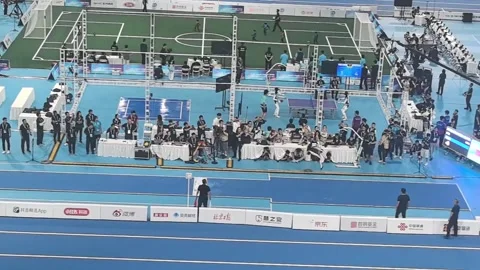 China: Humanoid robot achieves 7.97-meter long jump during competition in... Stock Footage 343544608