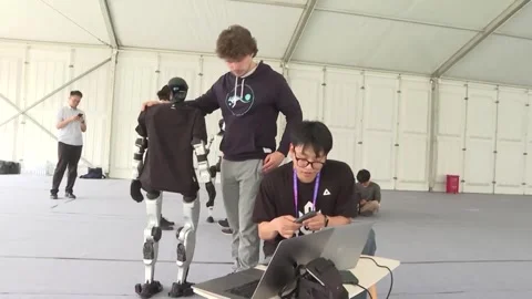 China: Humanoid robots gear up for Beijing half-marathon Stock Footage 332977735