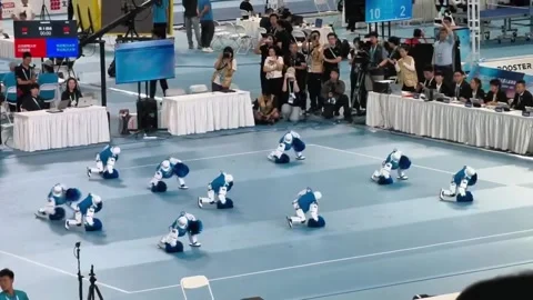 China: Humanoid robots tumble during cheerleading routine at World Robot ... Stock Footage 343569407