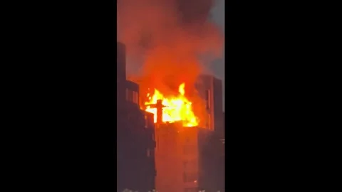 China: Intense fire engulfs upper section of residential building in Chon... Stock Footage 343562810