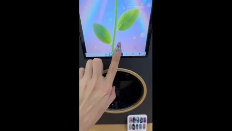 China: Kitty-pattern nails printed instantly by smart manicure machine in... Stock Footage 323418342