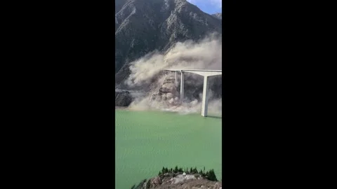 China: Landslide causes partial collapse of Hongqi Bridge in Sichuan, Chi... Stock Footage 321119441