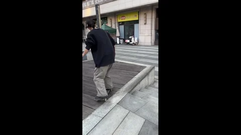 China: Loose plank causes sudden skateboard fall in Sichuan, China Stock Footage 327654060