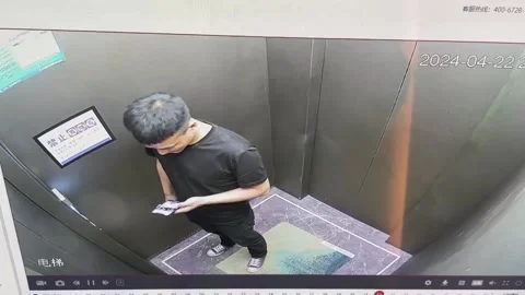 China: A Man Puzzled by a Double-door Elevator Stock Footage 276310258
