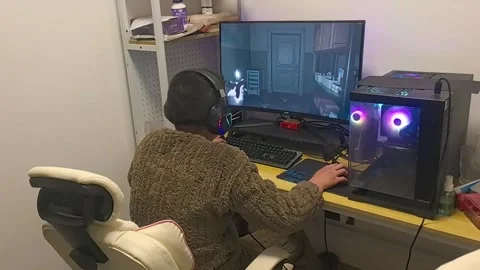 China: Man startled by zombie while playing Resident Evil Requiem in Chon... Stock Footage 330791085