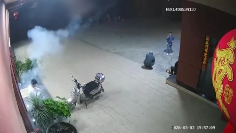 China: Man struck by stray firework during nighttime in Sichuan, China Stock Footage 330172609
