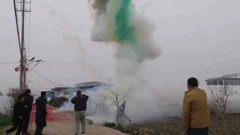 China: Mans jacket damaged after firecracker mishap in Shandong, China Stock-Footage 331365639