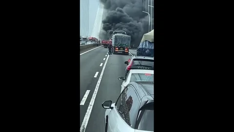 China: Massive bridge fire causes major traffic congestion in Jiangsu, Ch... Stock Footage 344678745