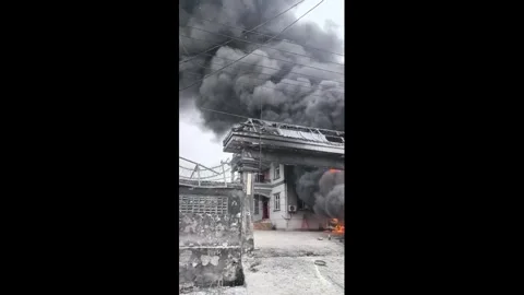 China: Massive building fire sends thick smoke billowing into sky in Yunn... Stock Footage 344299089