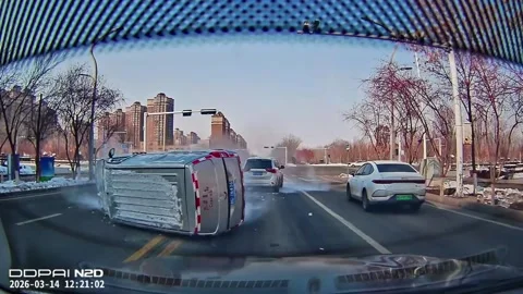 China: Mini van overturns after collision with SUV in Xinjiang, China Stock Footage 332285066