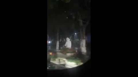 China: Motorcyclist crashes while avoiding water on flooded road in Yunna... Stock Footage 333836948