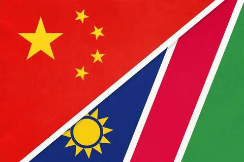 China or PRC vs Namibia national flag from textile. Stock Photos