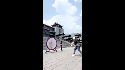China: Performers demonstrate precision ring-and-knife routine during pra... Stock Footage 336327530