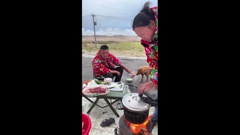 China: Pressure cooker suddenly explodes while woman is cooking outdoors ... Video stock 346822986
