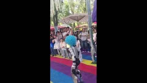 China: Robot kick accidentally hits boy during demonstration in Xinjiang,... Stock Footage 336302605
