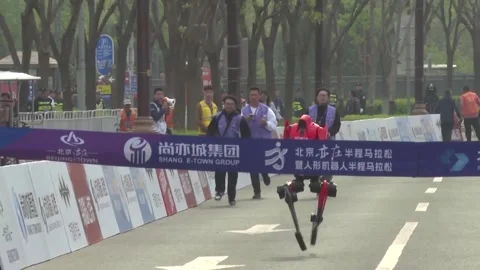 China: Robot 'Lightning' wins Beijing E-Town humanoid robot half-marathon... Stock Footage 333032740