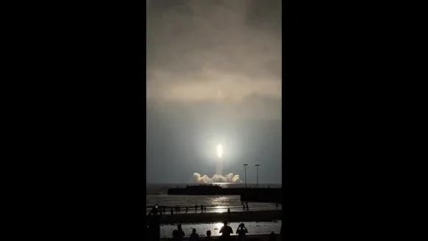 China: Rocket launch turns a simple day of beachcombing into a spectacle Stock Footage 320656284
