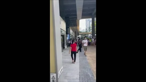 China: Shenzhen Residents Queue Up For Mass COVID Testing Video stock 170447639