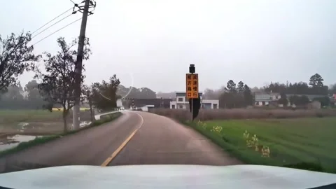 China: Swerving mini cargo van spins off road as it near miss in Hunan, C... Stock Footage 331294380