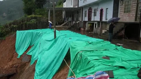 China: Tropical storm forces evacuation of over 17,100 in southwest China... Stock Footage 320808335