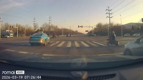 China: Two motorcycles collide at intersection and slide toward taxi in T... 스톡 동영상 331118849