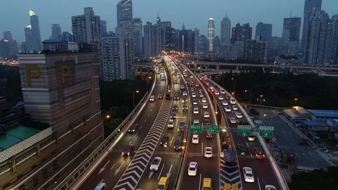 China urban landscape at dusk - drone flight over highway skyline Shanghai Stock Footage
