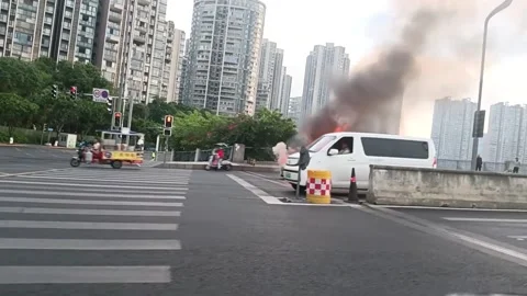 China: Vehicle engulfed in flames on major roadway in Chengdu, Sichuan, C... Stock Footage 337123789