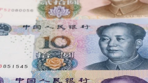 China yuan notes close up tracking. Yuan currency. Slider shot, low angle. 4K Stock Footage