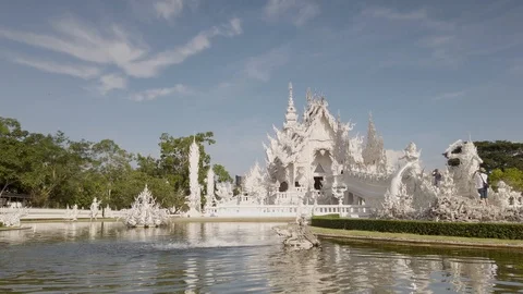 Chinag rai white temple reflection lakesunny day Stock Footage 109437984