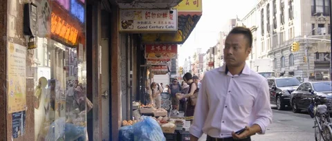 Chinatown man going into store Stock Footage 116762517