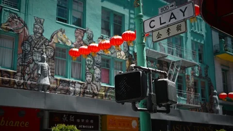 Chinatown San Francisco Hanging Chinese lanterns Green Light Traffic Man Stock Footage