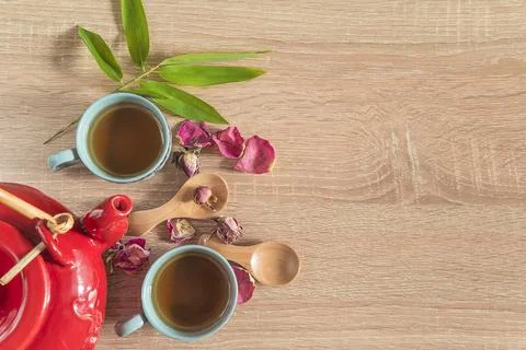 Chineese tea time concept: two chineese cups of tea, red teapot, two wooden.. Stock Photos