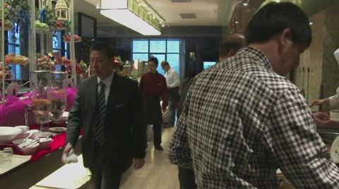 Chines people at breakfast buffet Stock Footage 51785428