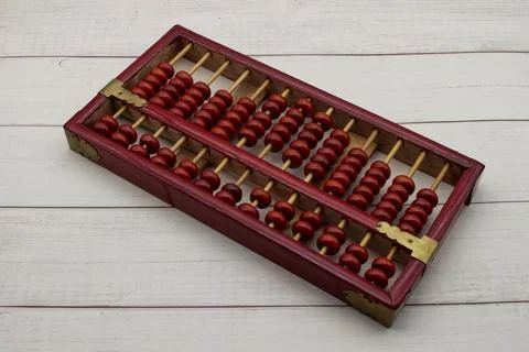 Chinese Abacus. Math calculation tool. Ancient calculator. Wooden background Stock Photos