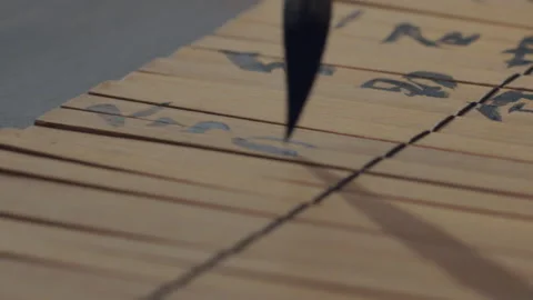 Chinese Art Of Calligraphy, Write with a brush on bamboo slips，china Stock Footage 140137153