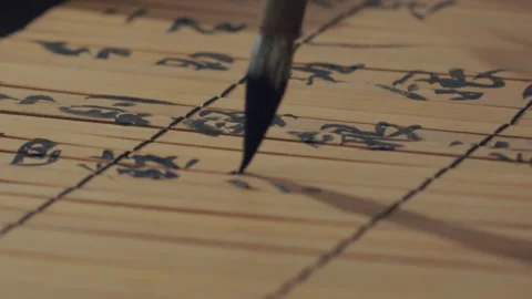 Chinese Art Of Calligraphy, Write with a brush on bamboo slips，china Stock Footage 140137674