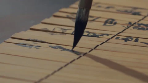 Chinese Art Of Calligraphy, Write with a brush on bamboo slips，china Video stock 140137957