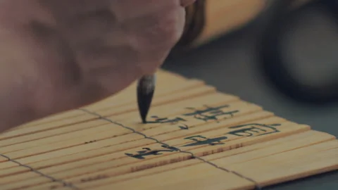 Chinese Art Of Calligraphy, Write with a brush on bamboo slips，china Stock Footage 140139361