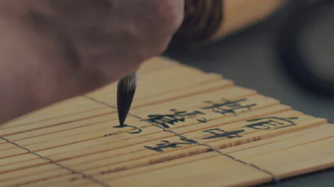 Chinese Art Of Calligraphy, Write with a brush on bamboo slips，china Stock Footage 140139468