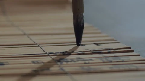 Chinese Art Of Calligraphy, Write with a brush on bamboo slips，china Stock Footage 140140274