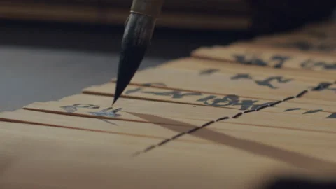 Chinese Art Of Calligraphy, Write with a brush on bamboo slips，china Stock Footage 140140937