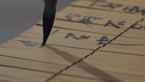 Chinese Art Of Calligraphy, Write with a brush on bamboo slips，china Stock Footage 140141129