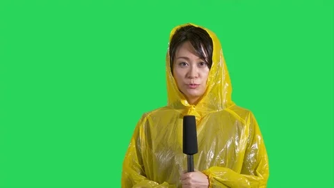 Chinese Asian weather reporter on green screen Stock Footage